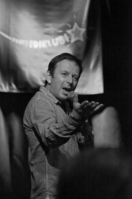 Black and white live shot, reaching out to the audience