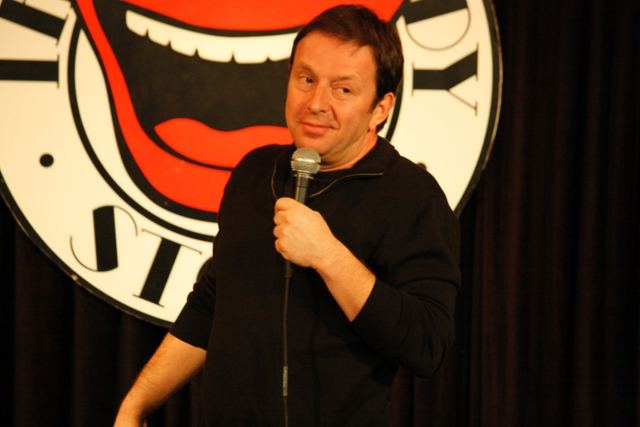Standing centre stage at the Comedy Store